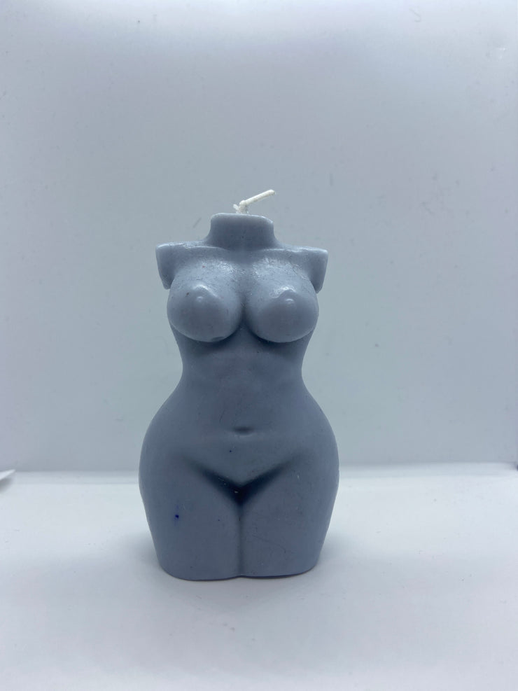 Vegan handmade candle of a curvy woman bust.