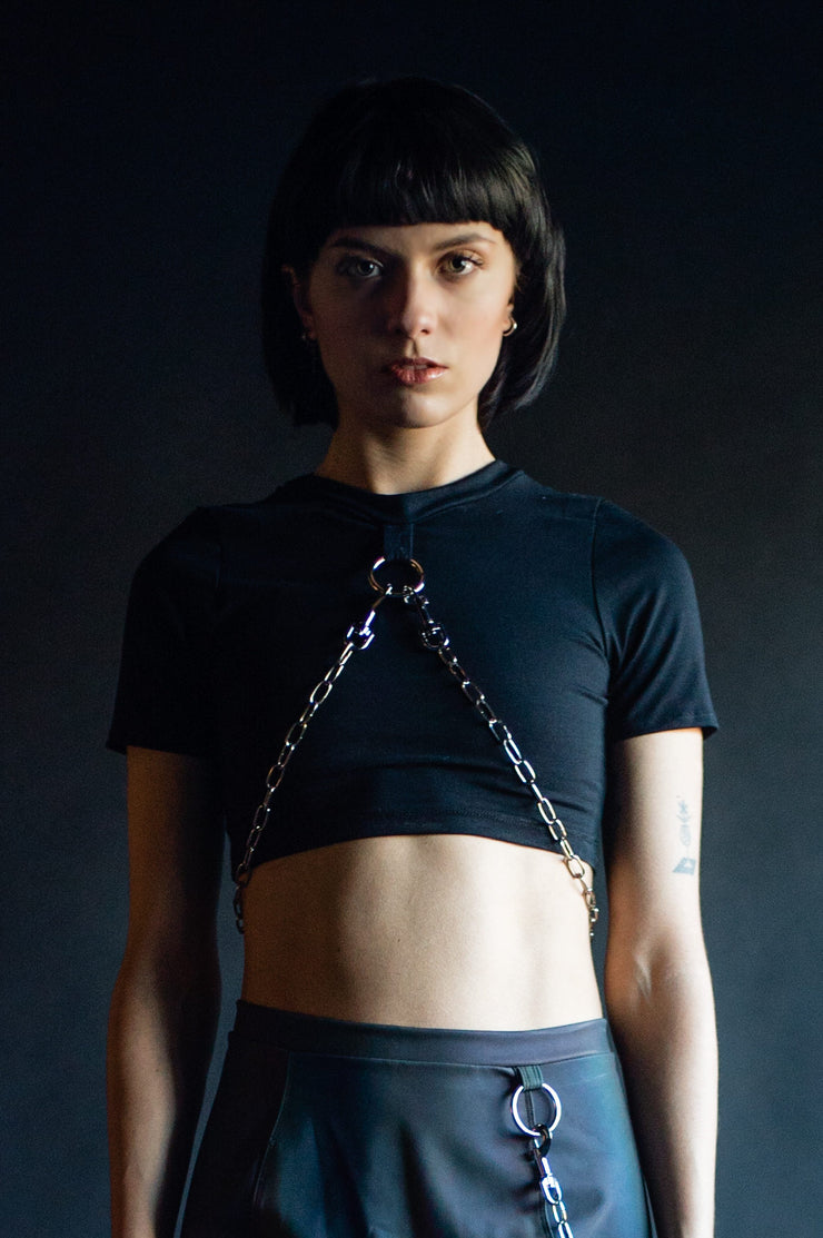 Black cotton cropped tshirt with o-ring hardware and a silver chain.
