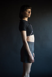 reflective skirt with chain and hardware and black crop top with O ring and chain