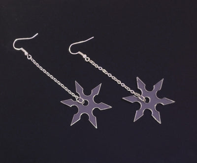 Clear earrings in the form of a ninja star with silver chains.